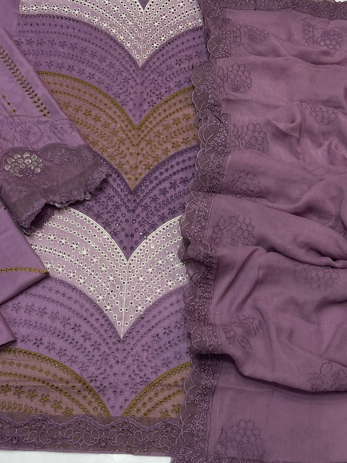 Model wearing a luxury lavender embroidered 3 piece suit with chevron details and matching dupatta.